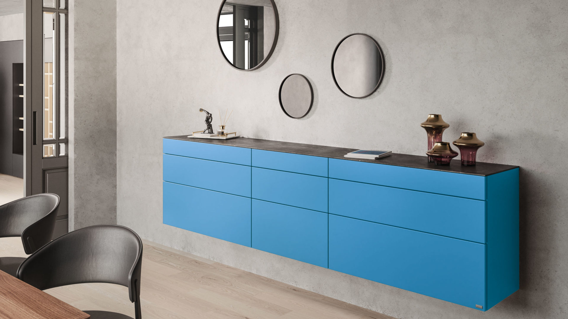 hülsta neo wand sideboard in blau an einer grauen wand mit deko