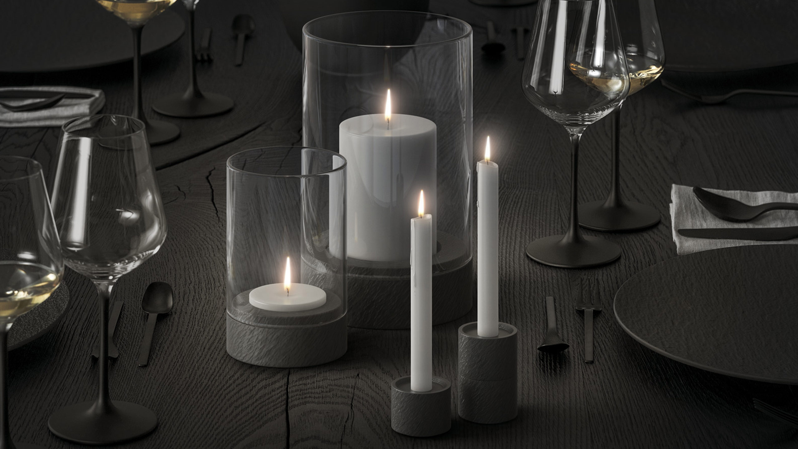graue kerzen auf einem dunkel gedeckten esstisch von villeroy & boch