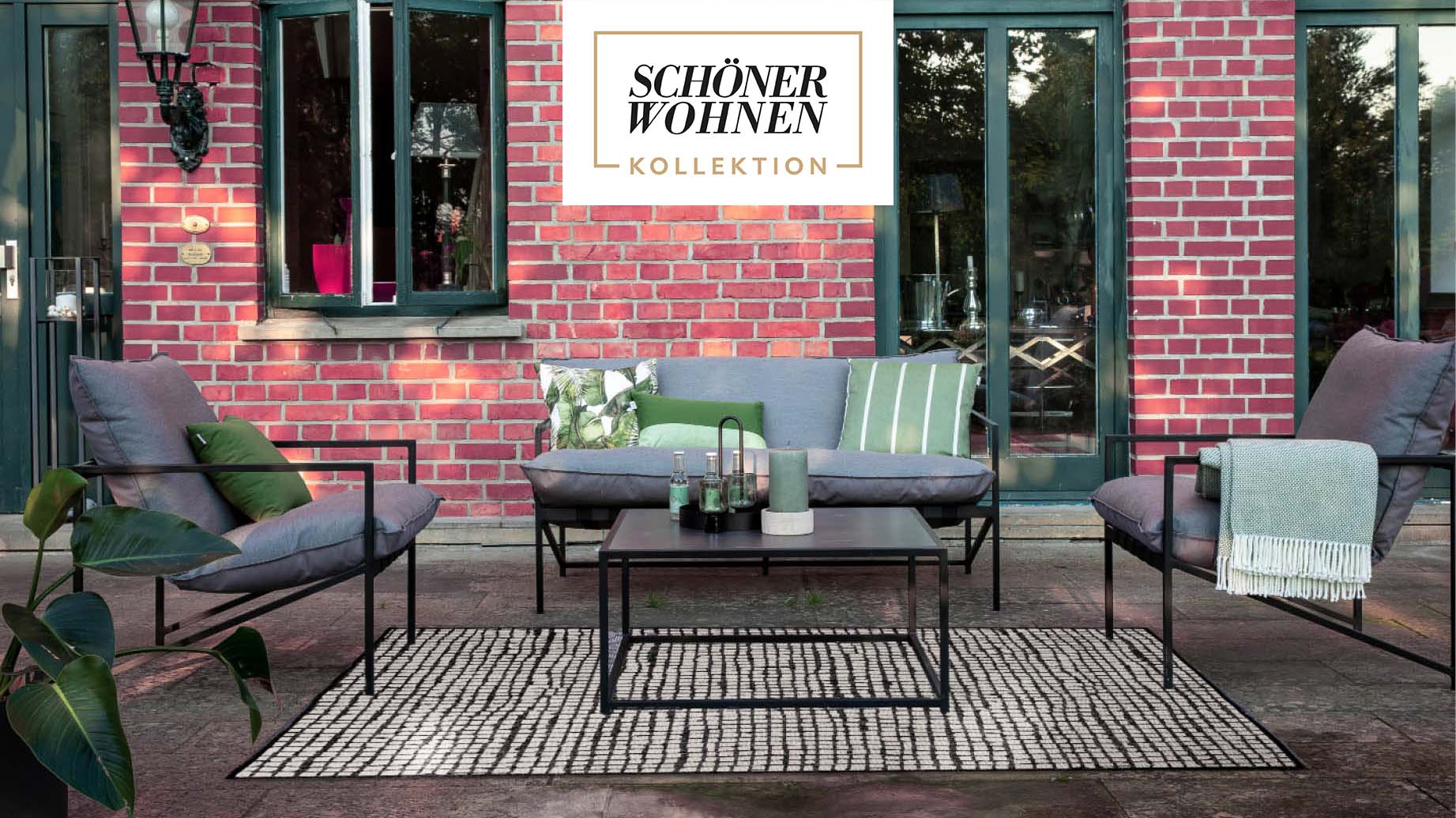 Graue Lounge-Gruppe mit Outdoor-Teppich und Schöner Wohnen Logo oben